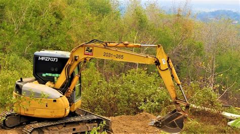 land clearing with mini excavator